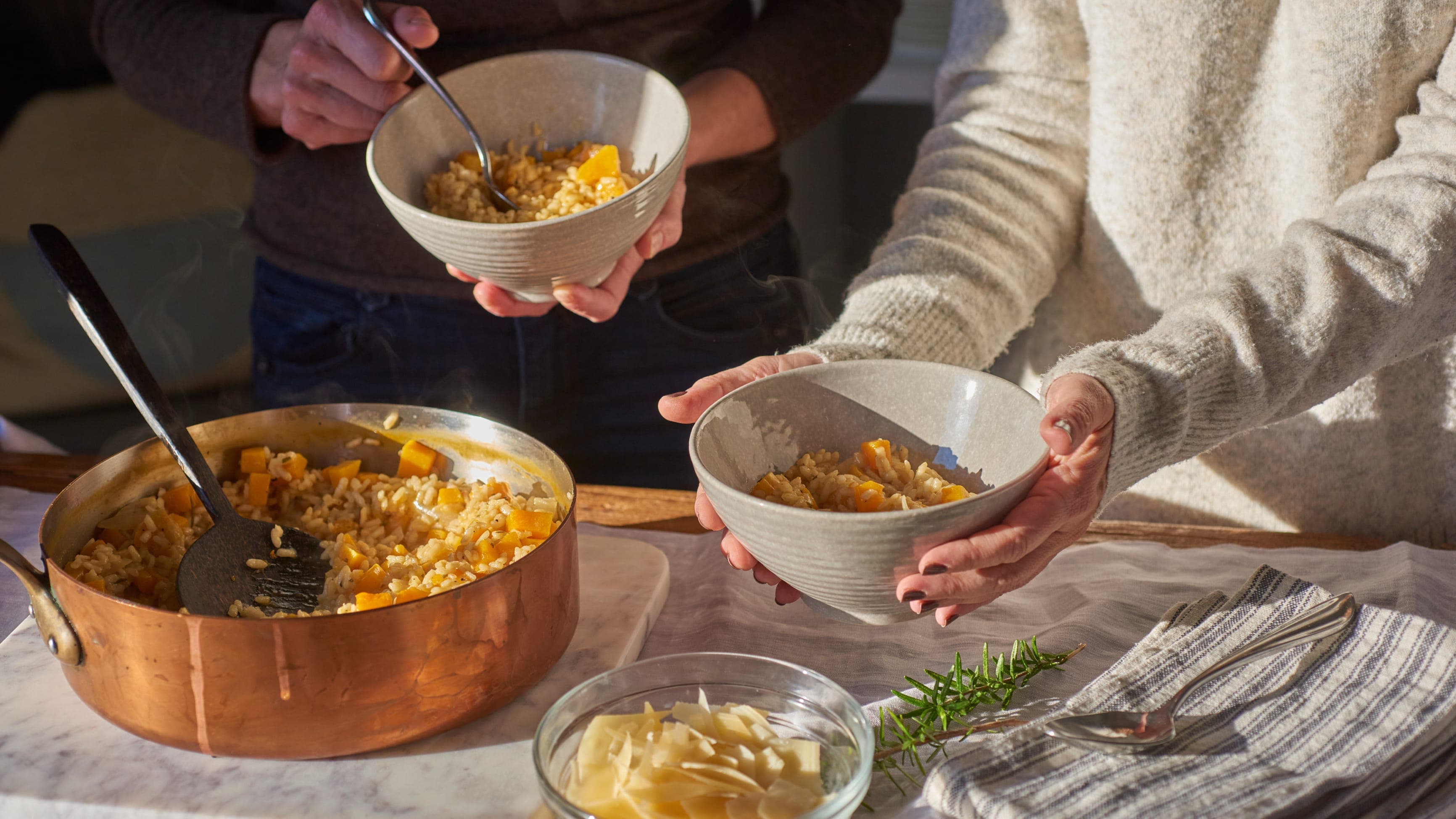 Image of Stephanie holding a freshly cooked dish